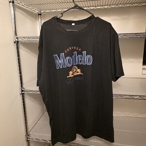 Modelo Black Tee with Blue and Orange Accents